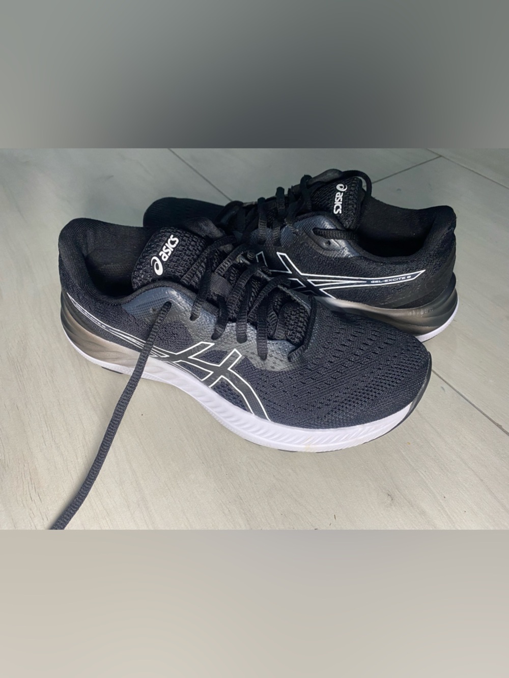 ASICS Black and White women’s Athletic Running Shoes
